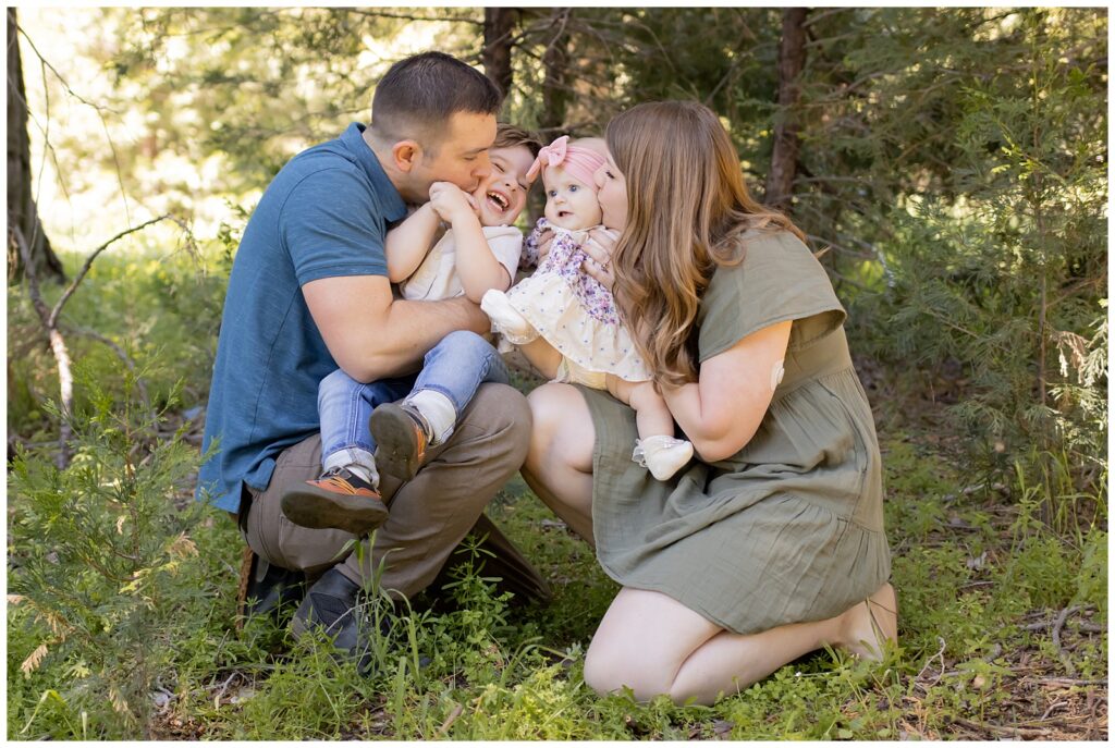 Tom and Madison kissing Theo and Ollie's cheeks in Cedarpines Park